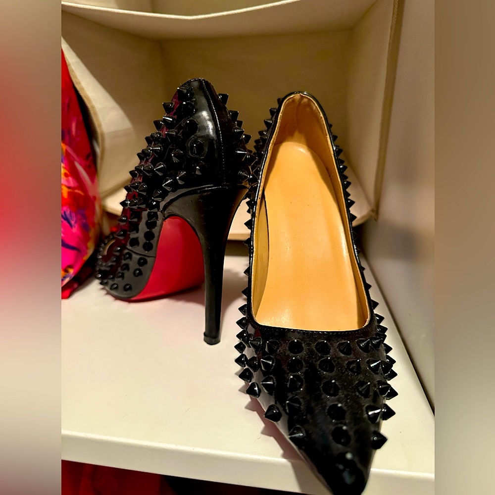 Red bottom black heels with spikes